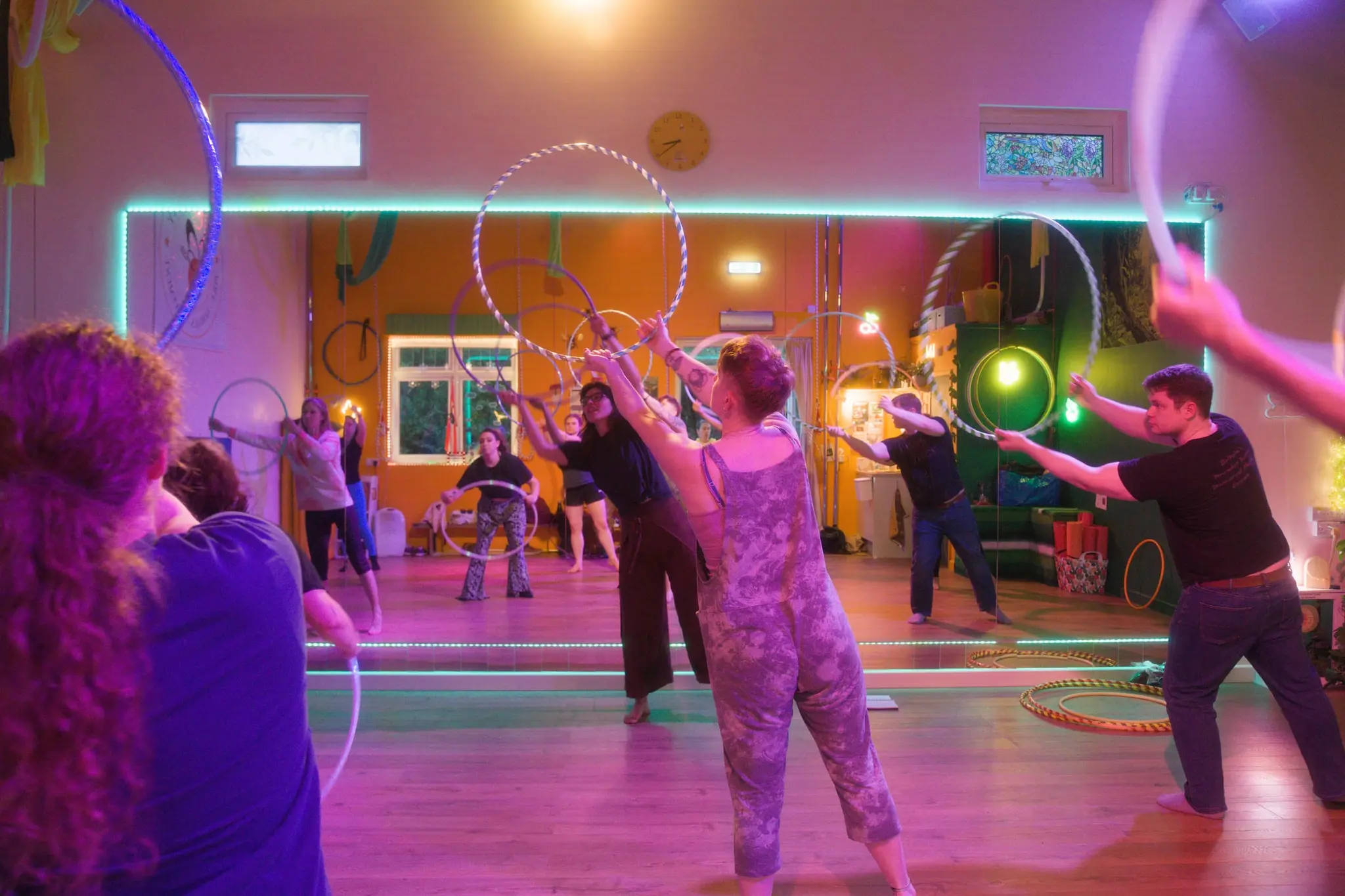 Energetic group hula hoop session in full flow
